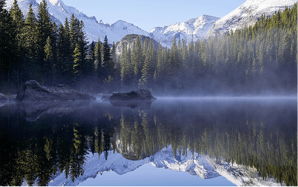 Stunning Maroon Bells reflecting on the water in the early morning hours in the Elk Mountains, just outside of Aspen.