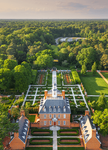 Aerial view of the expansive Governor’s Palace and beautiful garden grounds at Colonial Williamsburg.