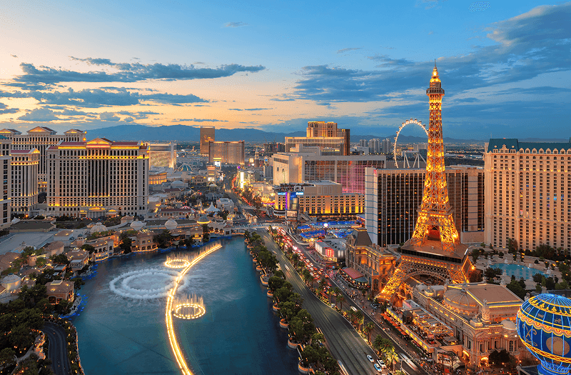 Aerial view of the Las Vegas Strip with the Fountains of Bellagio, Eiffel Tower Viewing Deck, and High Roller.