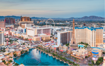 Aerial view of the Las Vegas Strip with the Fountains of Bellagio, Eiffel Tower Viewing Deck, and High Roller.