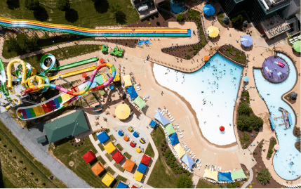 Aerial view of Massanutten’s Outdoor WaterPark with colorful slides, a wave pool, cabanas, and more.