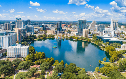 Aerial drone view of Lake Eola and downtown Orlando on a bright afternoon.