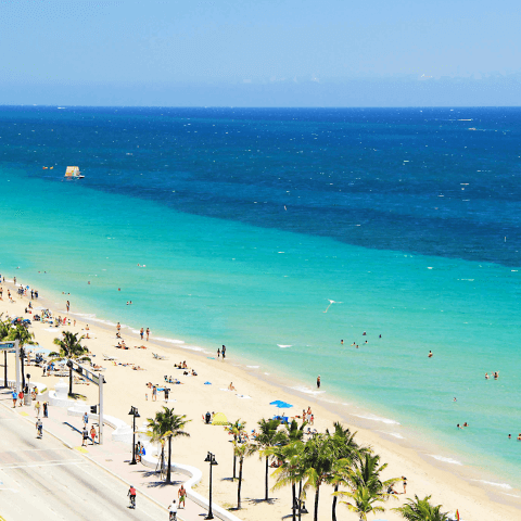 Aerial view of beach with clear sky in the background