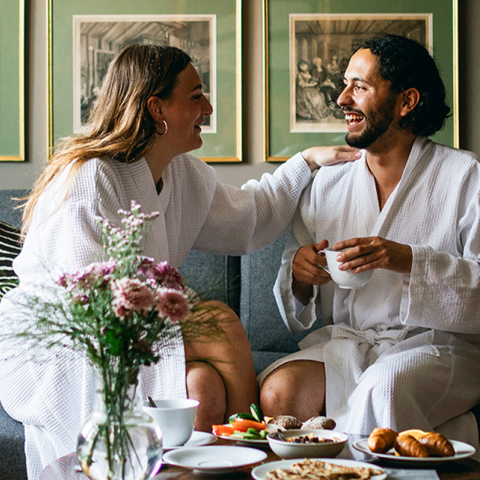 Two people talking and smiling