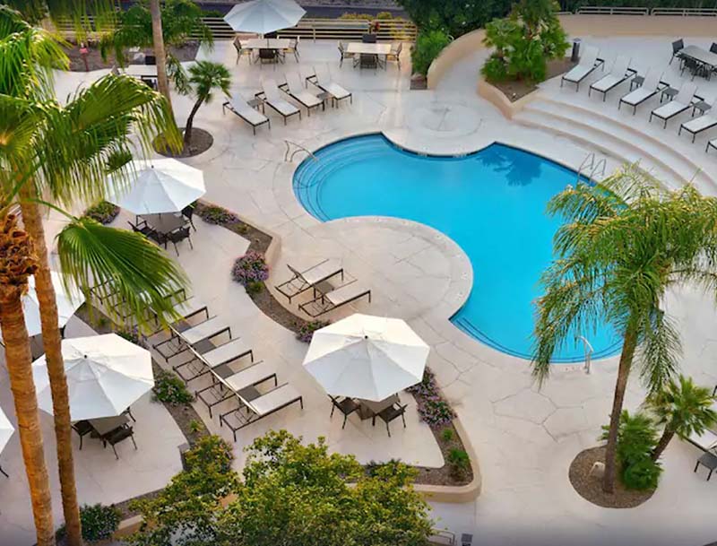 A bird's-eye view of the pool and deck area at the Hilton Tucson East hotel.