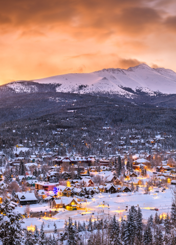 Snowy town with mountain in the background