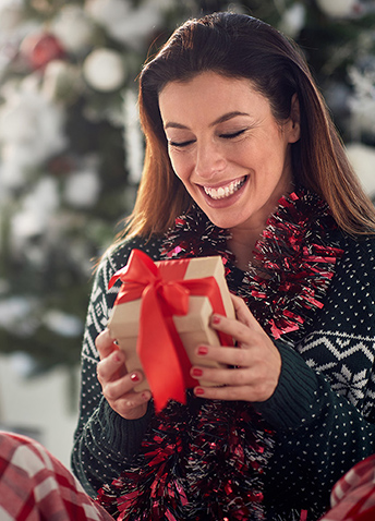 Woman holding a christmas gift box