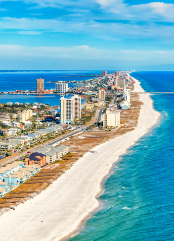 Aerial view of a coast with clear sky in the background