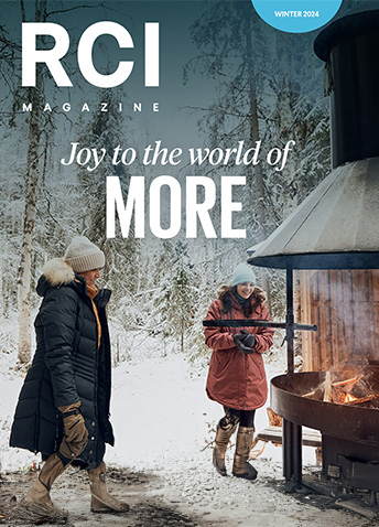 RCI Magazine cover, two people at an outdoor fireplace