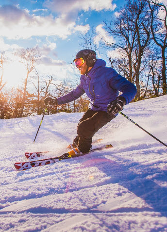 Person skiing with snowy background